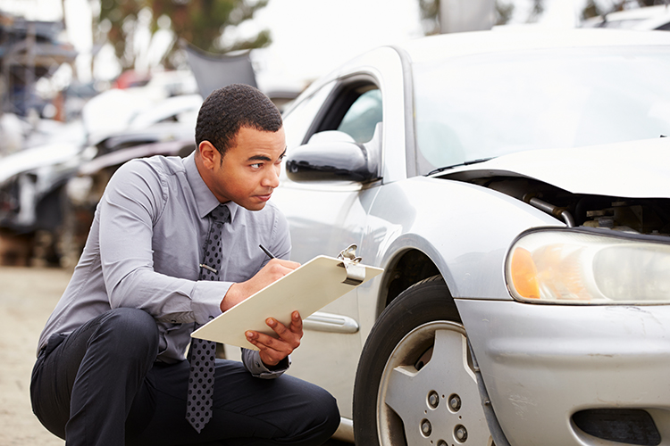 Loss Adjuster Inspecting Car Involved In Accident Auto Insurance | Metro East, IL